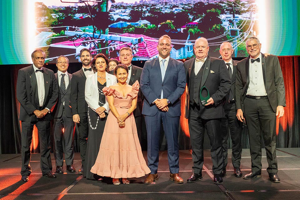 People on a stage recieving an award.