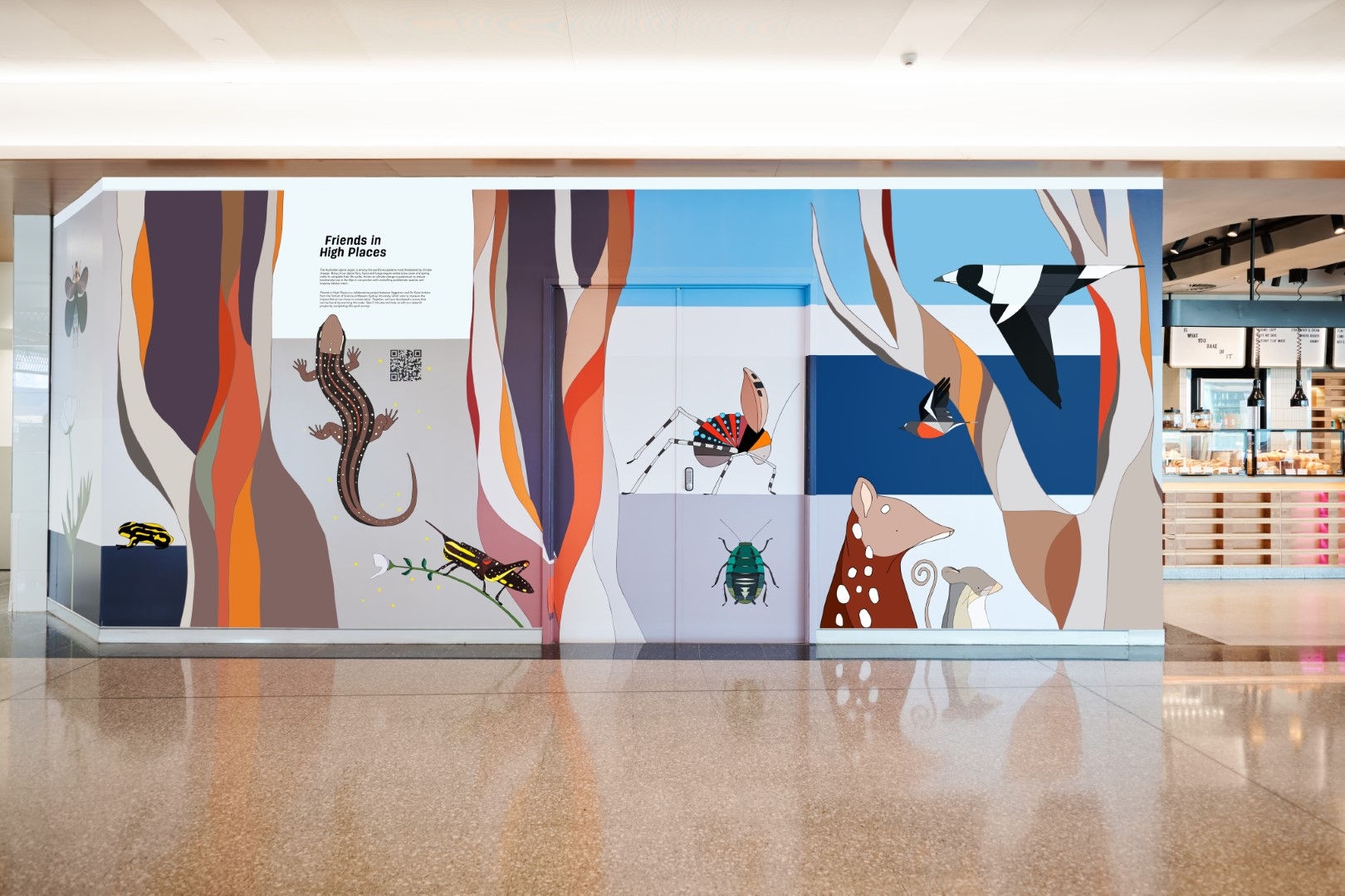 colourful artwork with animals on a office wall with a beige floor