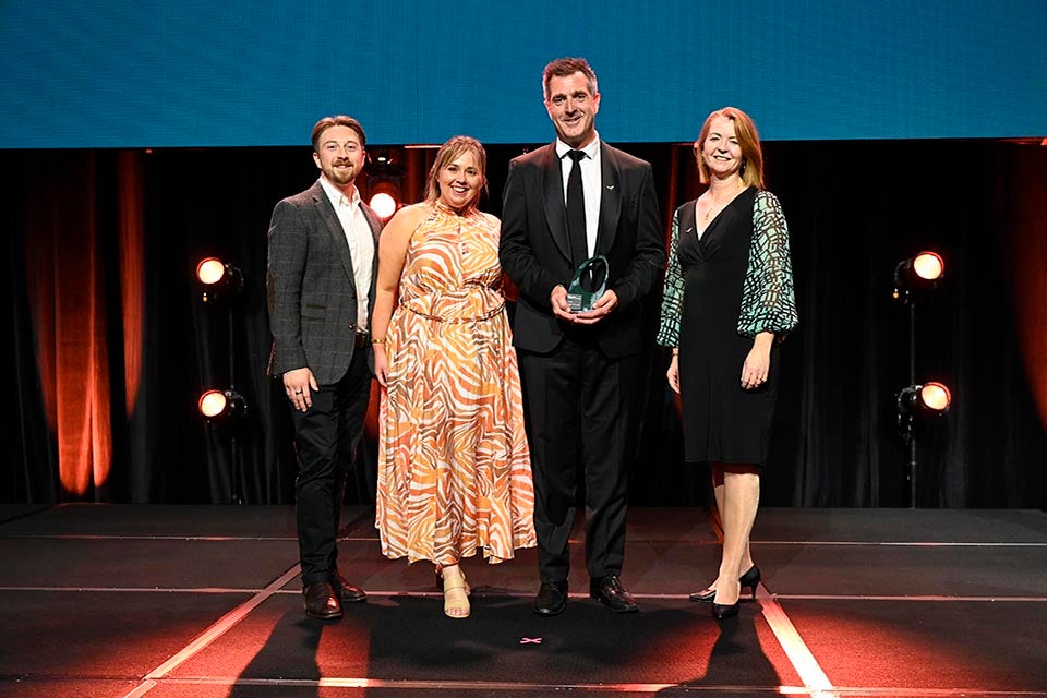 People on a stage recieving an award