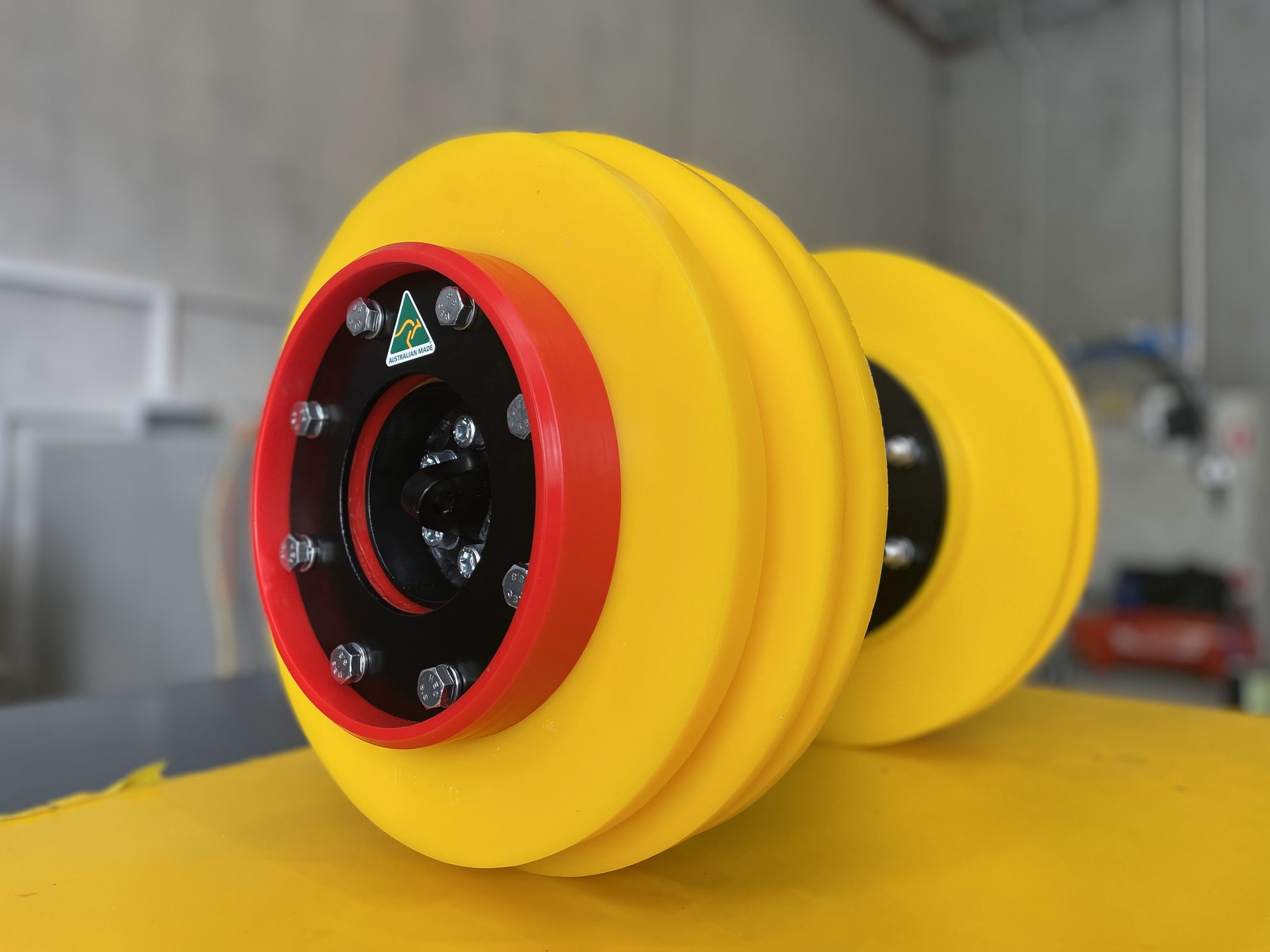 yellow circular product with red and black circle inside