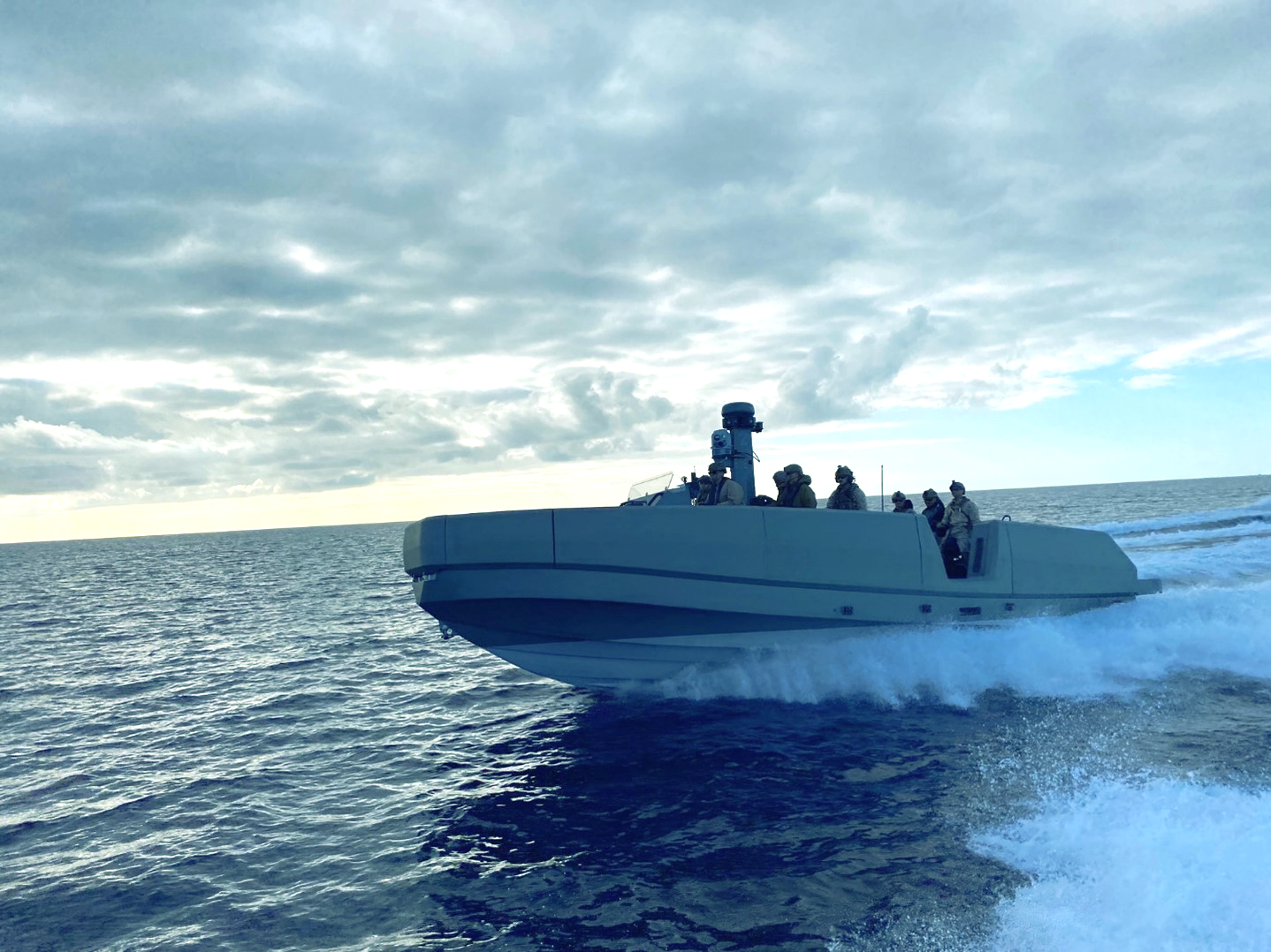 navy boat on ocean