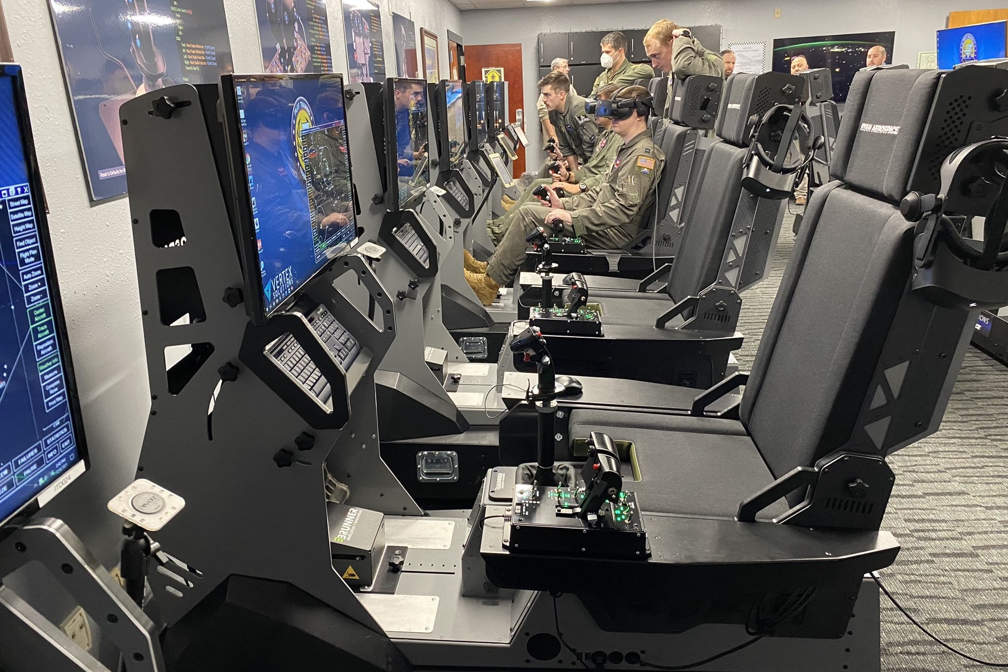 People sitting in a virtual reality of a training  simulation