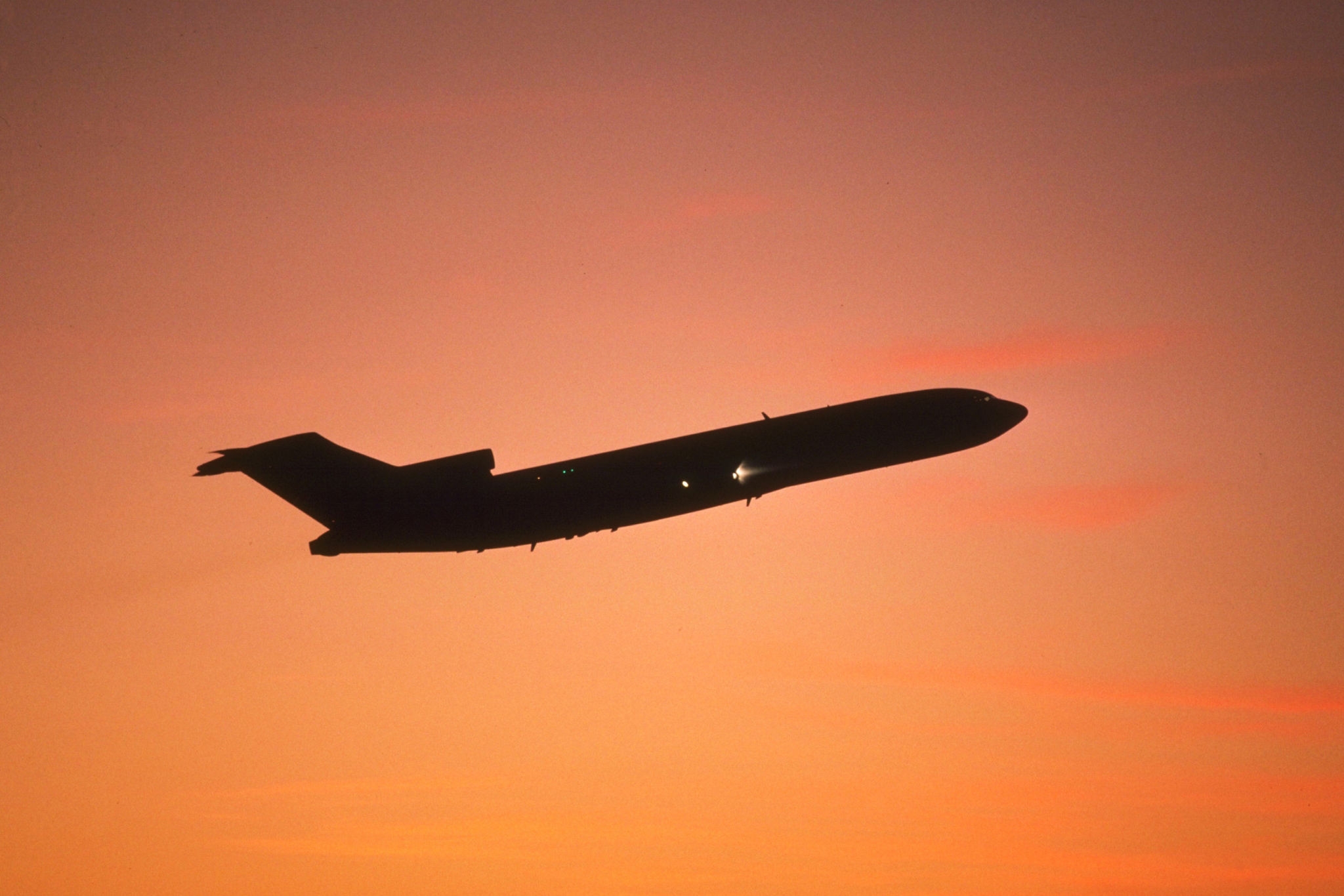 Aeroplane ascending at sunset 