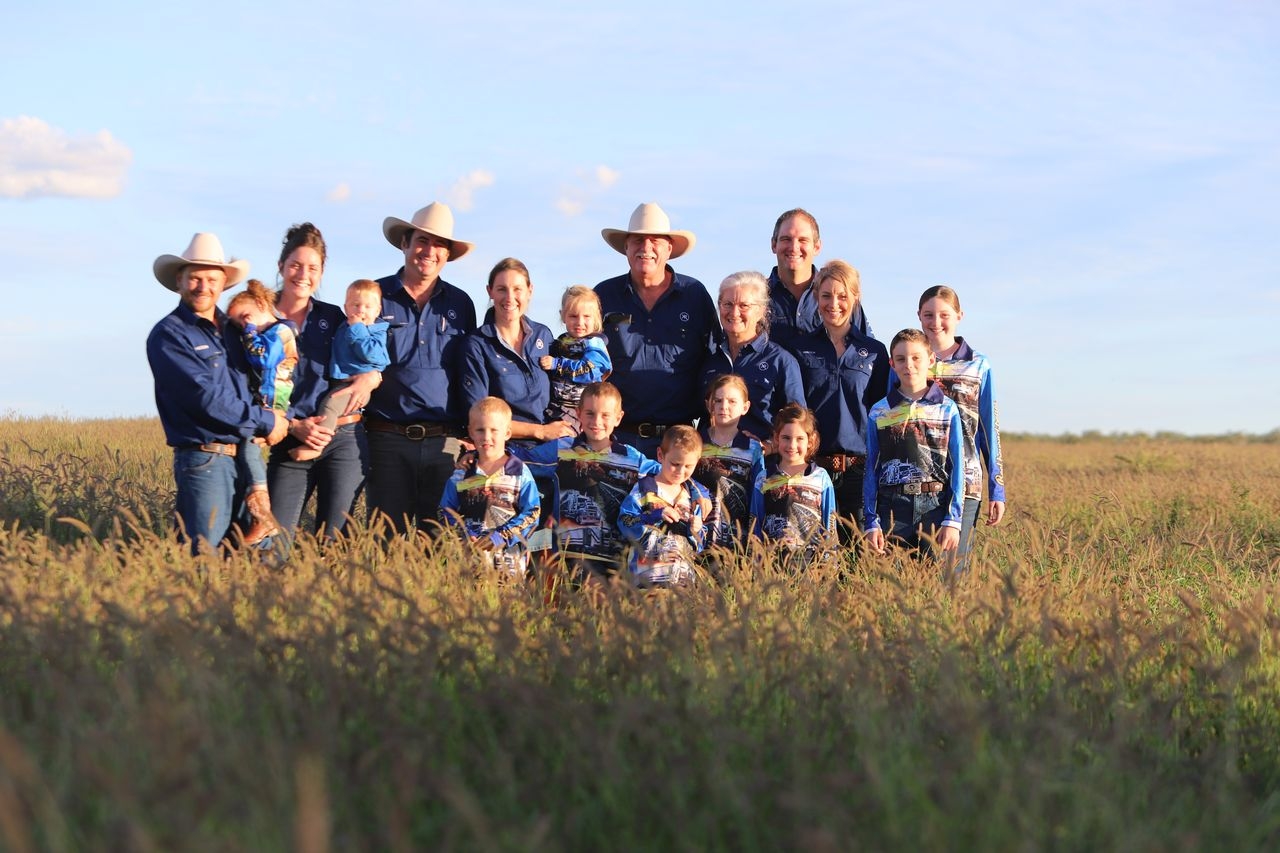 group of people standing in a field